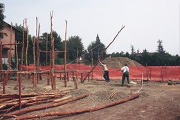 Construction of the first house got underway with the raising of vertical support spars.